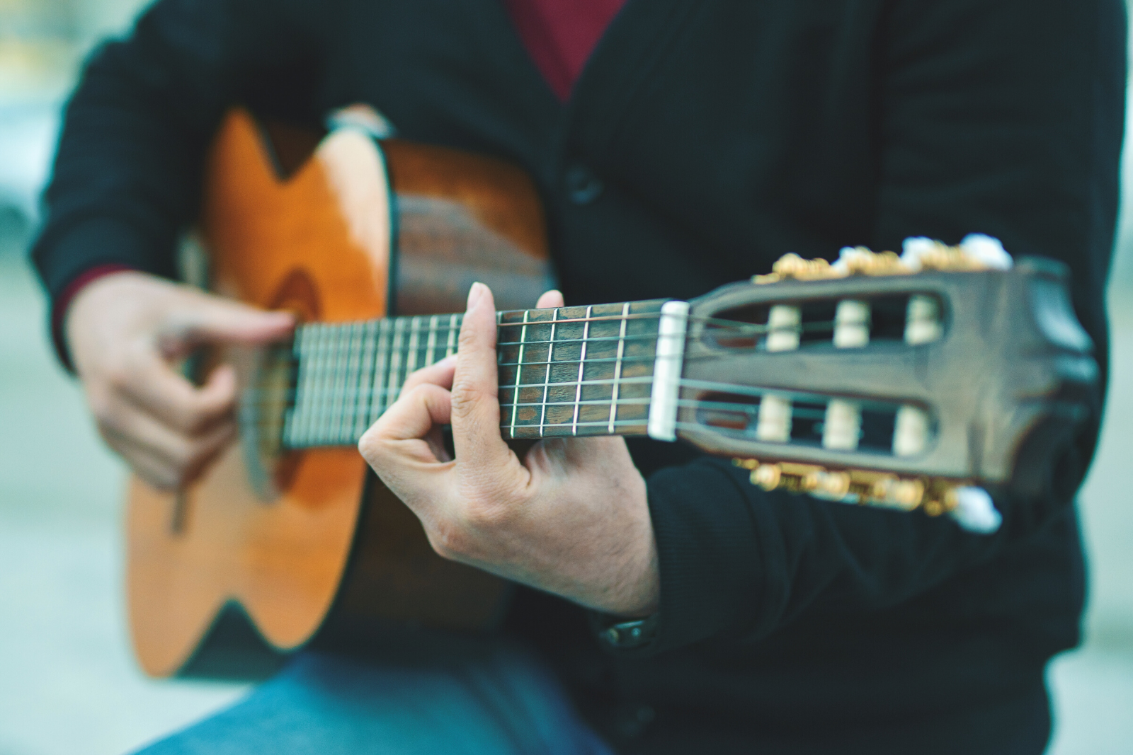 Man Playing Guitar | Which Is The Easiest Guitar To Learn For Beginners?